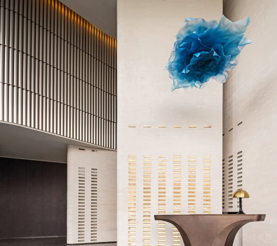 辦公樓前臺區(qū)米黃色大理石墻面效果圖