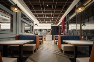 深圳龍華美式輕奢風(fēng)世紀(jì)春城茶餐廳裝修案例卡座效果圖