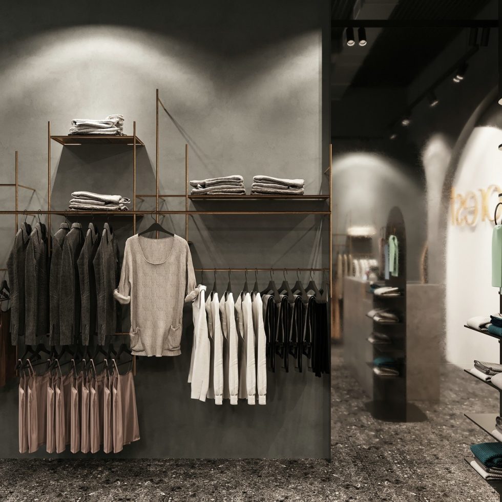 深圳市龍崗區(qū)平湖“森林” 名牌服裝店裝修設計墻面金色鋼管展架