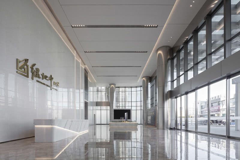 極簡輕奢風格辦公室裝修設(shè)計方案 前臺大廳側(cè)面圖