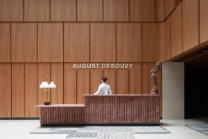 暖色調(diào)簡約風辦公室裝修設(shè)計接待臺效果圖