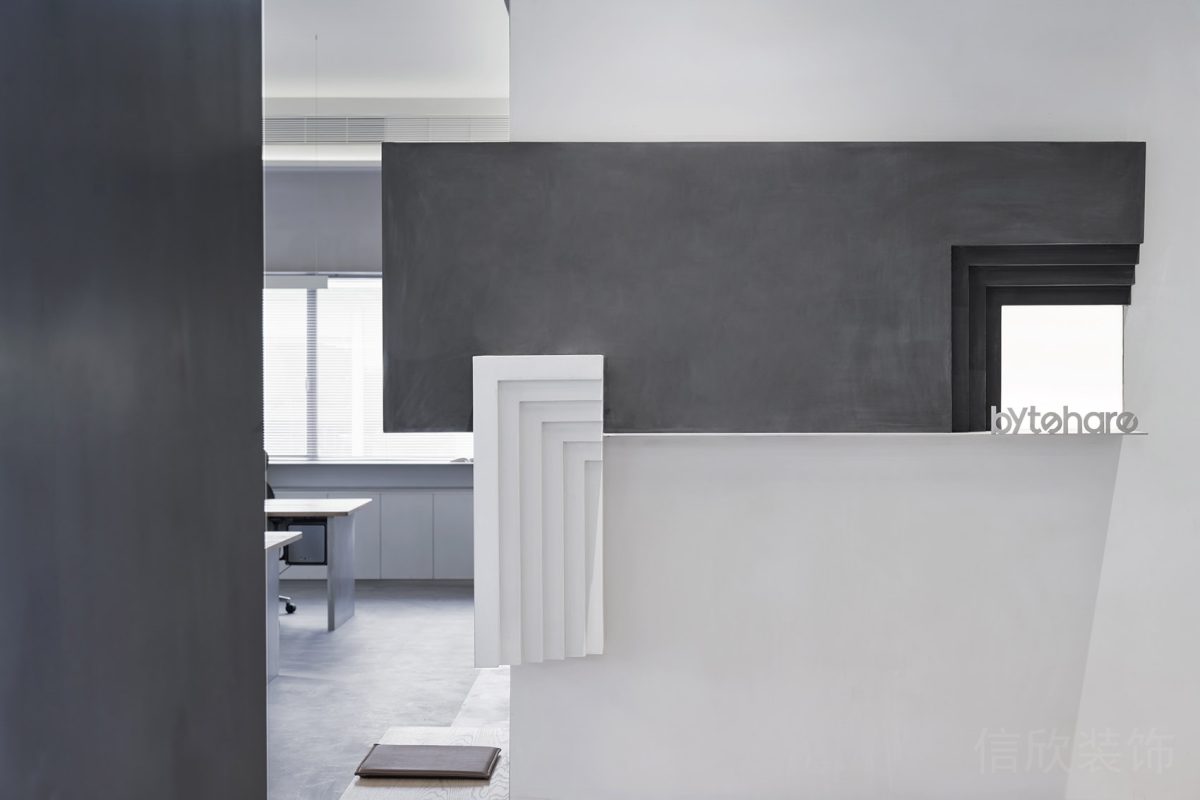 辦公室裝修灰色調(diào)設計幾何弧線設計前臺區(qū)效果