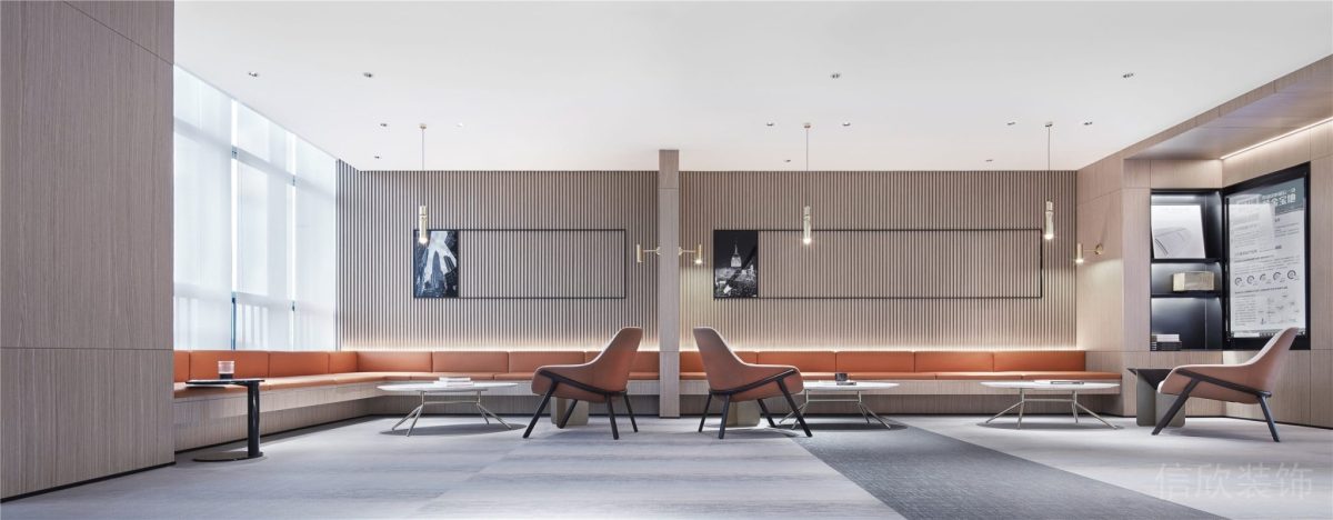 環(huán)形橙色沙發(fā)設計懸吊式銀色鋁合金射燈裝修辦公室員工休息區(qū)設計圖